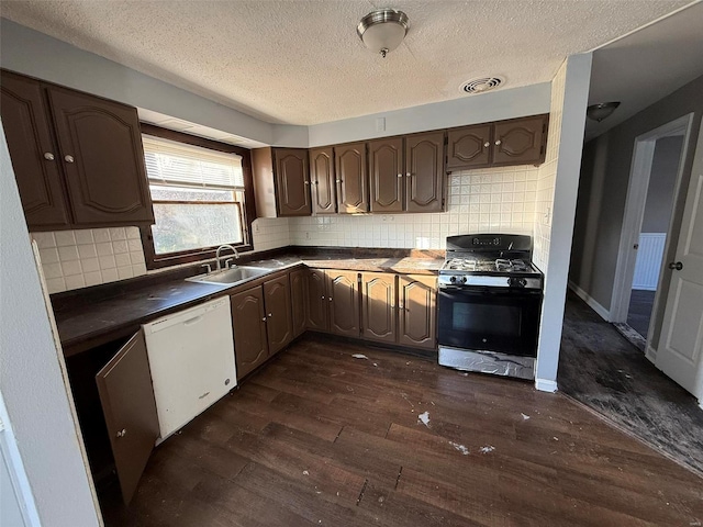 kitchen featuring sink, tasteful backsplash, dark hardwood / wood-style flooring, gas range oven, and white dishwasher