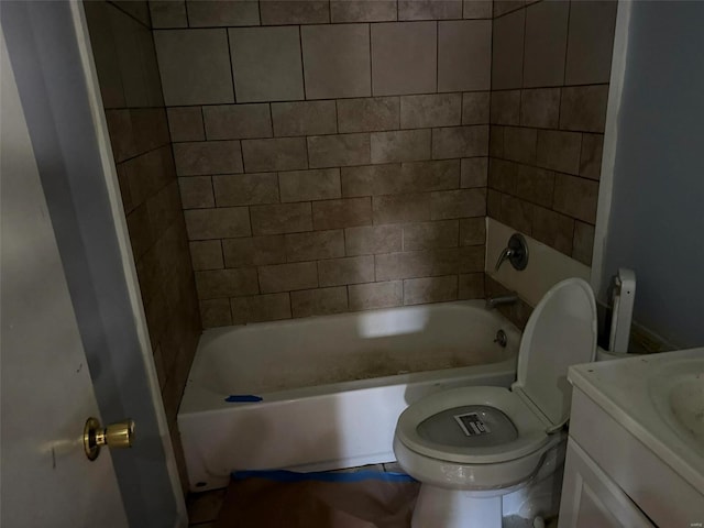 full bathroom with vanity, toilet, and tiled shower / bath