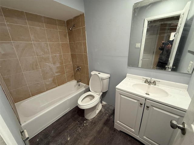 full bathroom with wood-type flooring, vanity, toilet, and tiled shower / bath