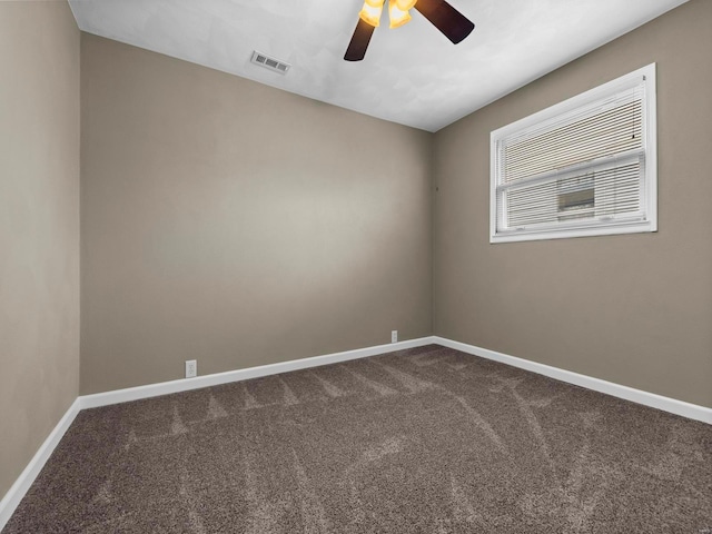 carpeted empty room featuring ceiling fan