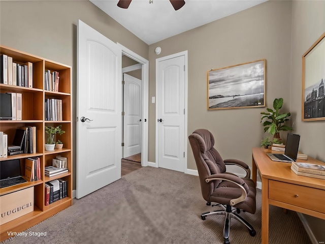 office space featuring ceiling fan and carpet flooring