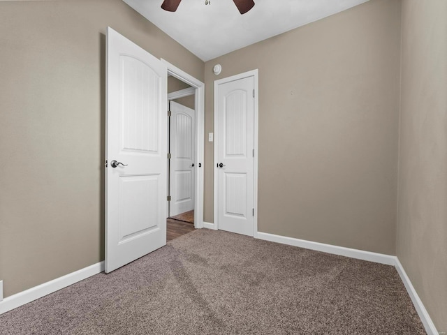 unfurnished bedroom with carpet floors and ceiling fan