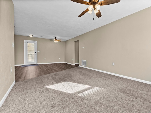 unfurnished living room with carpet and ceiling fan