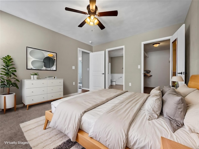 bedroom with connected bathroom, ceiling fan, and carpet