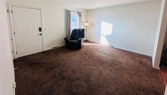 unfurnished room with dark carpet