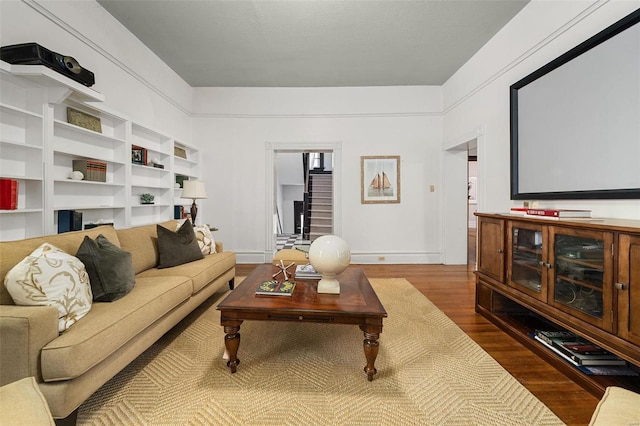 cinema room with dark wood-type flooring