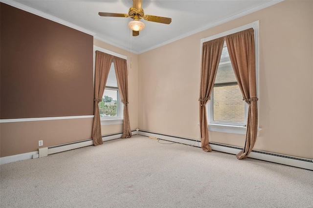 spare room featuring ceiling fan, crown molding, and light carpet