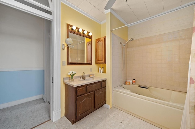 bathroom with washtub / shower combination, vanity, and crown molding