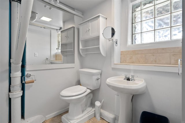 bathroom featuring tile patterned floors and toilet