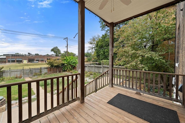 deck featuring a lawn and ceiling fan