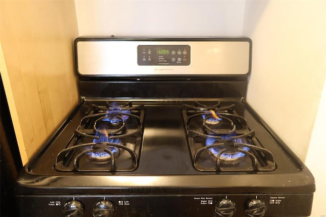 room details featuring black gas range