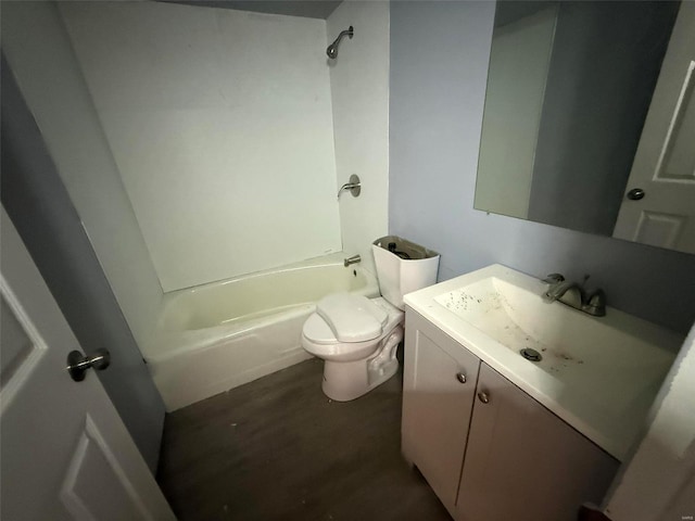 full bathroom with hardwood / wood-style floors, vanity, toilet, and tub / shower combination