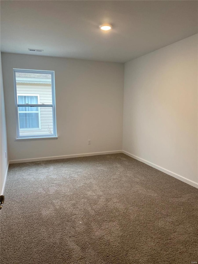 view of carpeted spare room