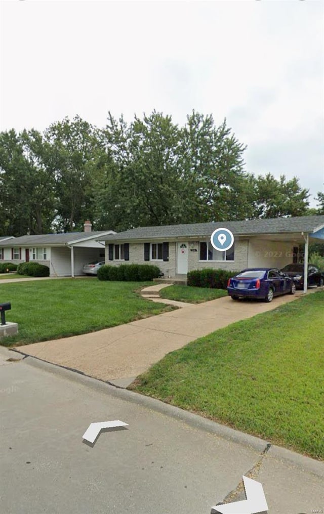 ranch-style home with a front lawn