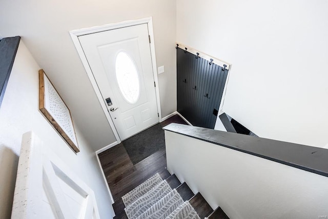 foyer entrance featuring dark wood finished floors