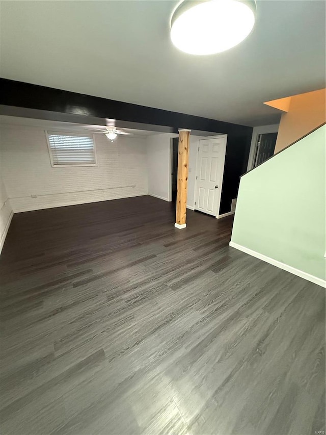 finished basement with baseboards and dark wood-style flooring