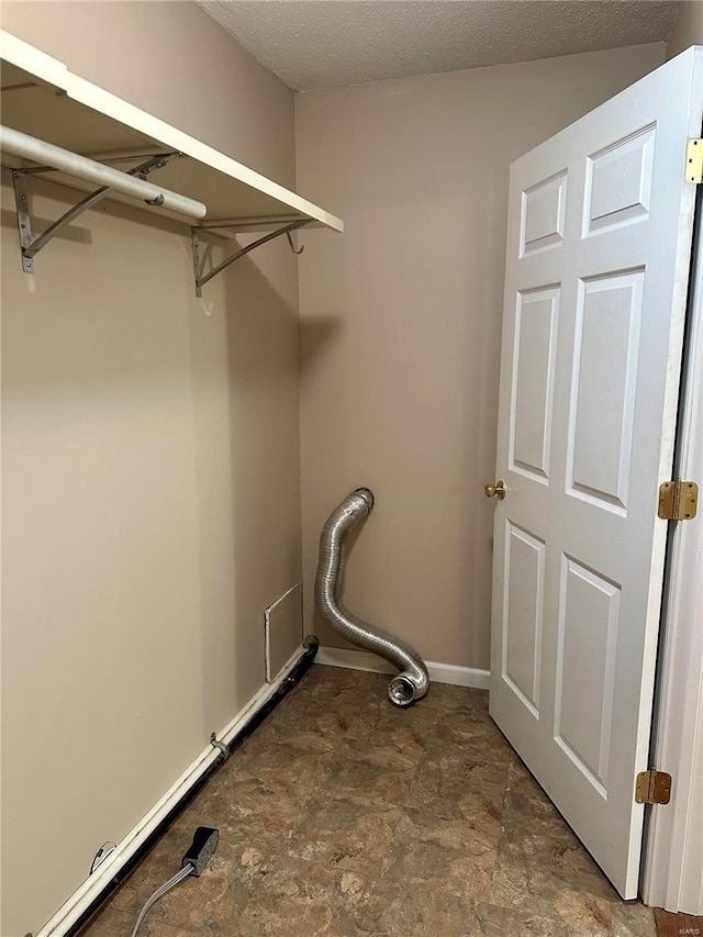 washroom featuring a textured ceiling