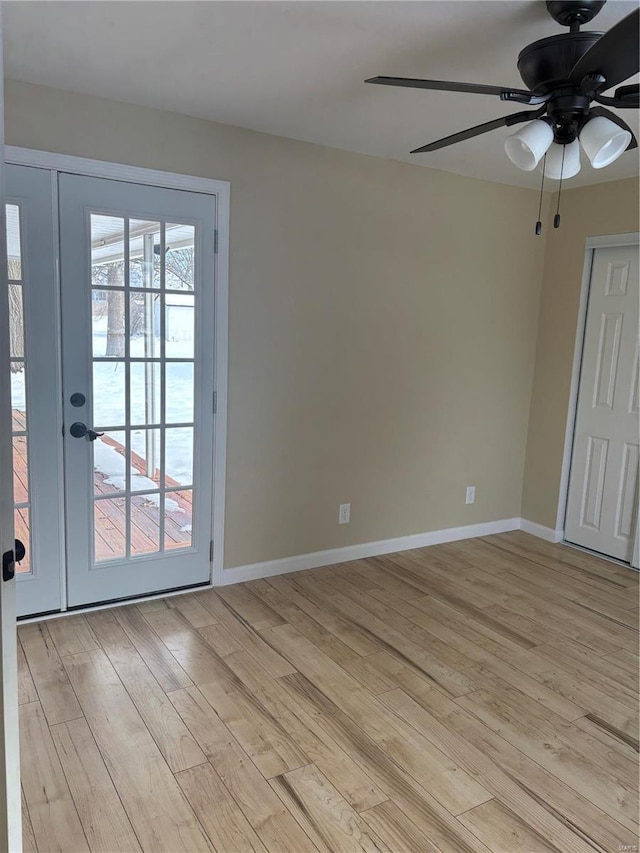 spare room with ceiling fan and light hardwood / wood-style floors