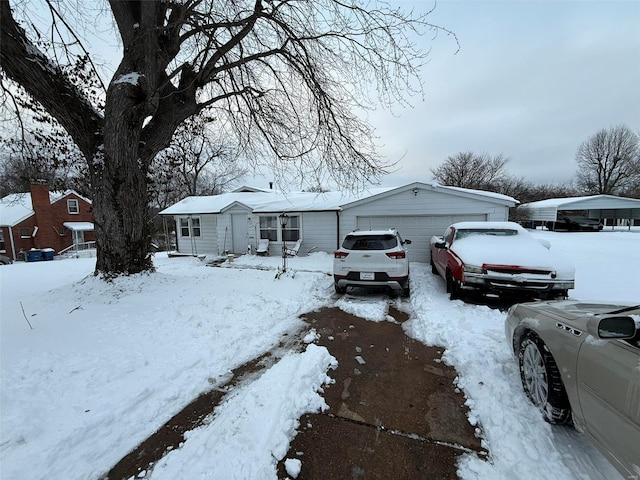 ranch-style house featuring a garage