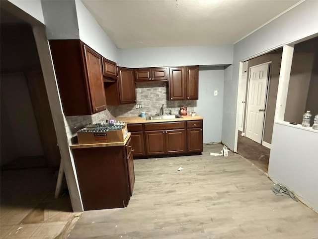 kitchen featuring decorative backsplash and sink