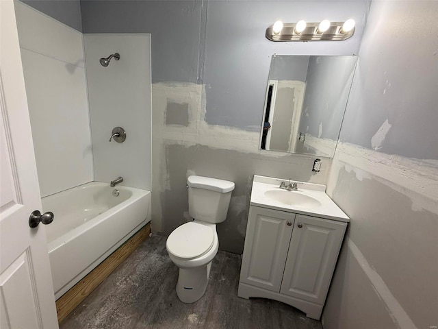 full bathroom with shower / bathing tub combination, hardwood / wood-style floors, vanity, and toilet