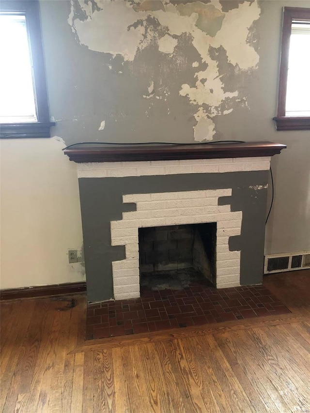 room details featuring hardwood / wood-style floors and a fireplace