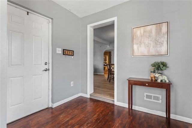 foyer with dark wood-type flooring