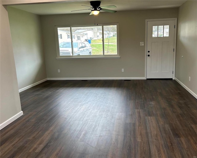 entryway with ceiling fan and dark wood-type flooring