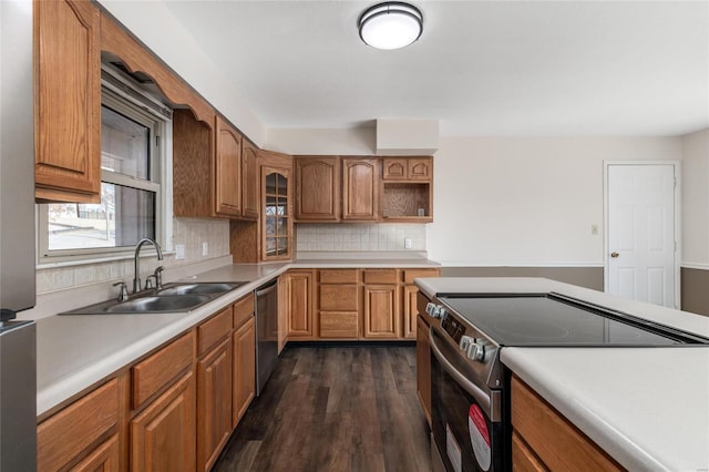 kitchen with decorative backsplash, dark hardwood / wood-style floors, sink, and stainless steel appliances