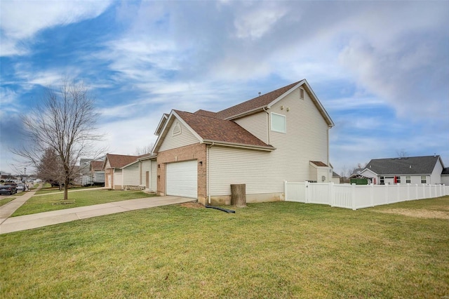 view of side of property with a yard