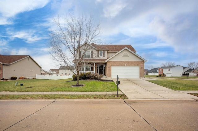 view of property featuring a front yard, a garage, and covered porch