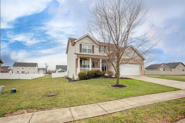 front facade with a porch, a front yard, and a garage