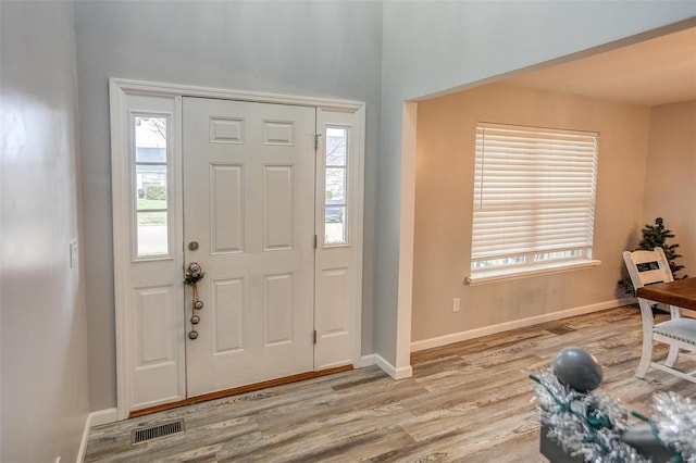 foyer with light wood-type flooring