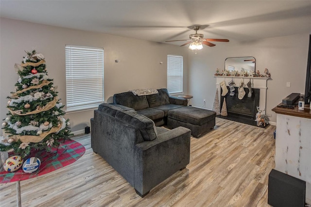 living room featuring hardwood / wood-style flooring and ceiling fan