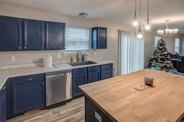 kitchen featuring dishwasher, wooden counters, blue cabinets, sink, and a chandelier