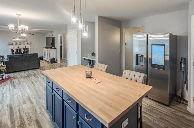 dining area with a notable chandelier and light hardwood / wood-style flooring