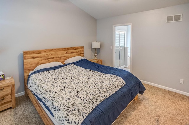 bedroom with carpet flooring and ensuite bathroom