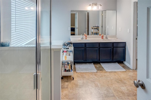 bathroom with tile patterned flooring, vanity, and a shower with shower door