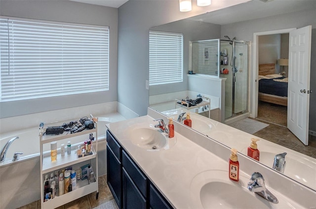 bathroom with plenty of natural light, vanity, independent shower and bath, and tile patterned flooring