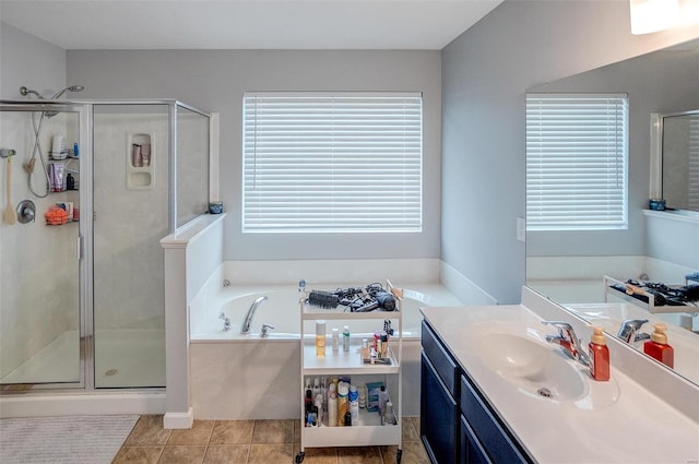 bathroom featuring tile patterned flooring, vanity, and independent shower and bath