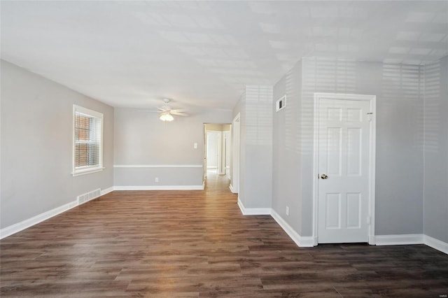 unfurnished room featuring ceiling fan and dark hardwood / wood-style flooring