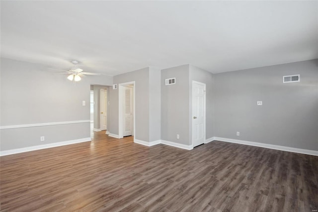 unfurnished room with ceiling fan and dark hardwood / wood-style floors