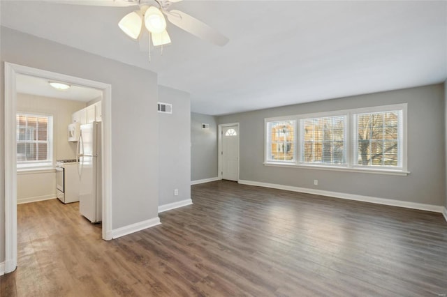 unfurnished living room featuring ceiling fan and hardwood / wood-style floors