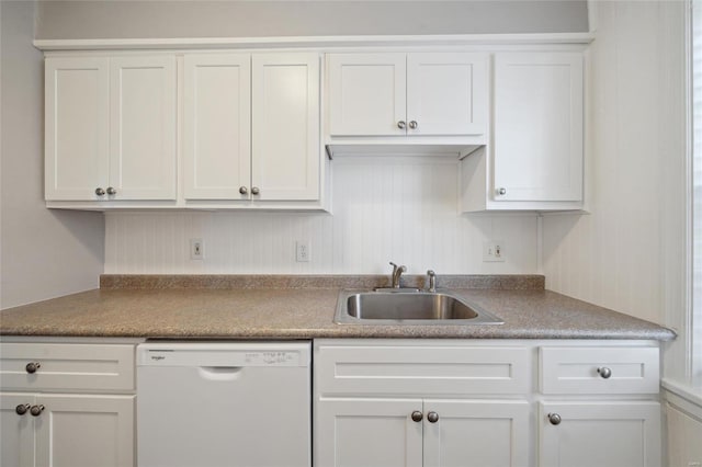 kitchen featuring white cabinets, dishwasher, and sink