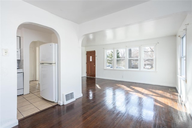 interior space with wood-type flooring and a wealth of natural light