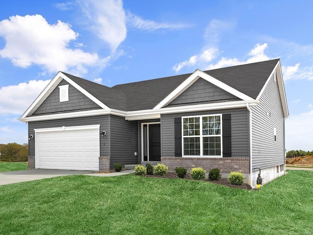 view of front of property featuring a front yard and a garage