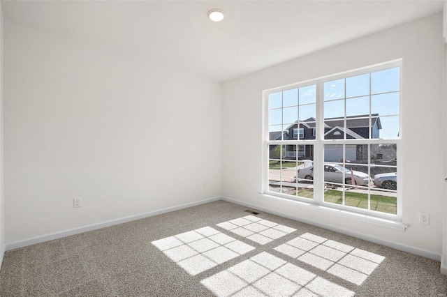 unfurnished room with carpet flooring