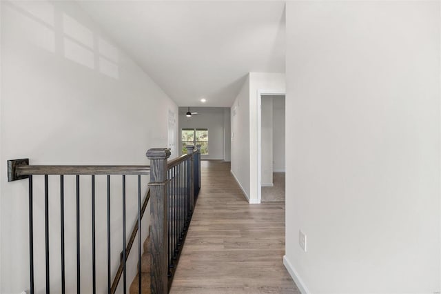 corridor with light hardwood / wood-style flooring