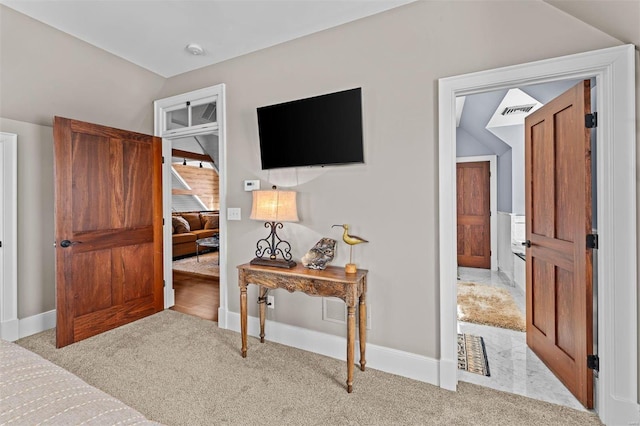 bedroom featuring lofted ceiling, carpet, visible vents, and baseboards