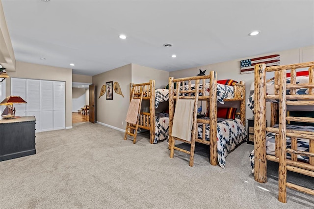 bedroom with carpet, baseboards, and recessed lighting